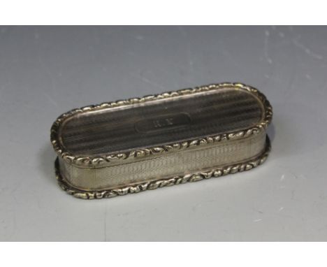 A George IV silver snuffbox of rounded oblong form, the hinged lid, sides and base with engine turned banding within cast fol