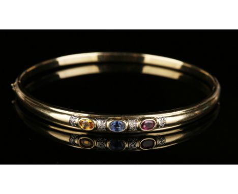 A 9ct gold, sapphire, diamond and coloured gem stone set oval hinged bangle, inside width approx 6cm.