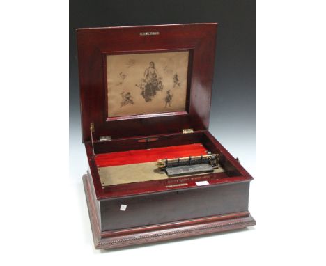 A late 19th Century Regina mahogany cased musical box, playing 39.5cm discs, the movement bearing number '9652', together wit