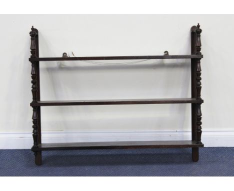 A mid-19th Century mahogany three-tier wall shelf with turned supports, height approx 79cm, width approx 96cm.