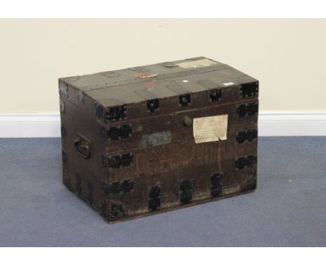 A late Victorian oak and metal bound silver trunk, the front bearing metal label inscribed 'Captn Douglas Gutton', the top an