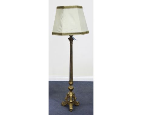 A 20th Century Italianate giltwood lamp standard, inset with mirror panels, the base carved with foliate scrolls, height appr