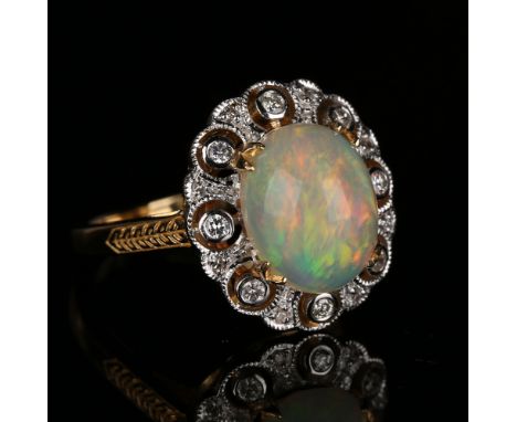 A gold, opal and diamond oval cluster ring, mounted with the oval opal in a pierced surround, mounted with circular cut diamo