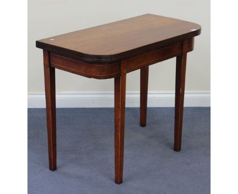 A 19th Century mahogany fold-over tea table, raised on square tapering legs, height approx 74cm, width approx 91cm.