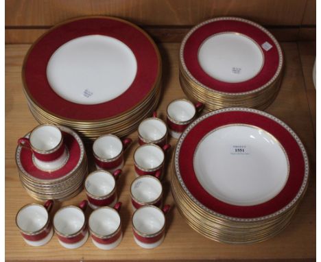 A Wedgwood 'Ulander' pattern part service, decorated with puce and gilt scroll borders, comprising eleven coffee cans and twe