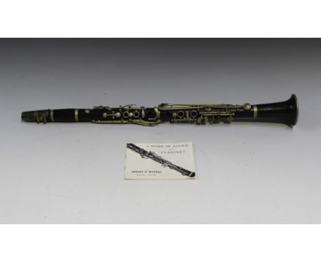 A French hardwood clarinet with nickel plated keywork, the end section marked 'Soma'.