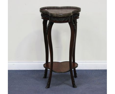 A mid-20th Century Louis XV style foliate inlaid and cast metal mounted two-tier table, the shaped top with a pierced brass g