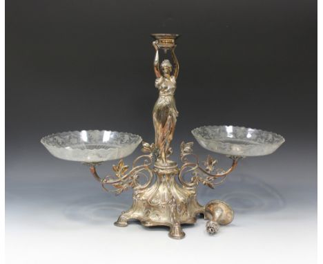 An early 20th Century Continental plated figural table centrepiece, the central standing maiden with arms raised aloft flanke