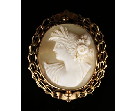 A gold mounted oval shell cameo brooch, carved as the portrait of a lady, width approx 4.5cm.