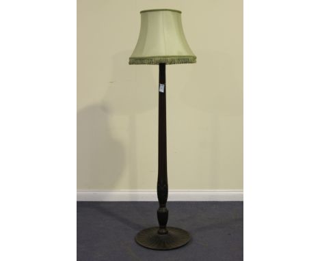 A 19th Century and later mahogany lamp standard with a carved and reeded stem, raised on a circular base, height approx 150cm