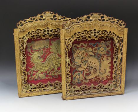 A pair of Southern Chinese embroidered panels within gilt lacquered wood double frames, mid-19th Century, one panel worked in