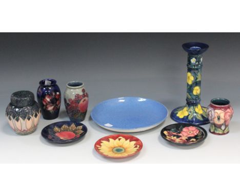 A collection of modern Moorcroft pottery, including a Buttercup design candlestick, designed by Sally Tuffin, height approx 2