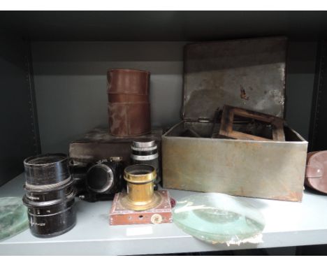 A selection of lenses including Ross, light meters etc af
