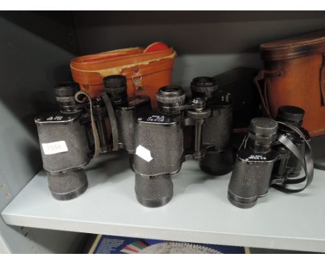 Three pairs of binoculars including Zenith 10x50 in original case, Pathe Scope 20x50 in original case and Swallow 8x30