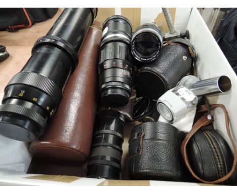 A box of lenses, filters and light meters etc including Sankor 1:4 telephoto, Takamur 135mm etc