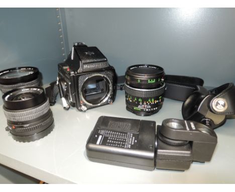 A Mamiya 645 TL camera body and three Mamiya- Sekor  lenses, a Macro 80mm, a 35mm, a 55mm, a Minolta light meter and a Billin