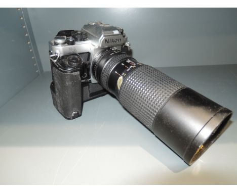 A Nikon FA camera with Nikon Autowind and Bell &amp; Howell 60-300mm lens