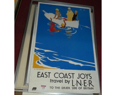 A reproduction travel poster print 'East Coast Joys'; together with four other locomotive prints (5)