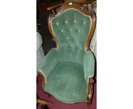 A Victorian mahogany framed and later green dralon button backed upholstered spoonback armchair on French forelegs