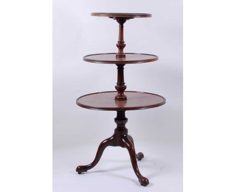 A George III mahogany three-tier dumb waiter, the dished graduated tiers each on ring and baluster turned columns, h.113cm, d