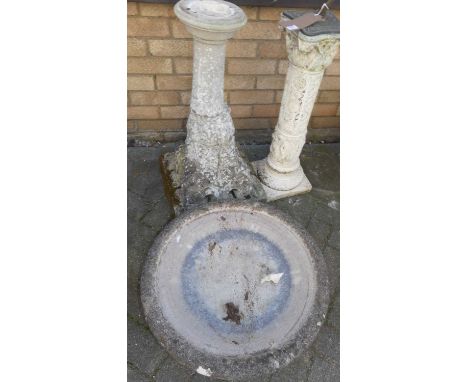 A reconstituted stone pedestal birdbath (in three sections) height 91cm, together with a stoneware torchere with sundial top 