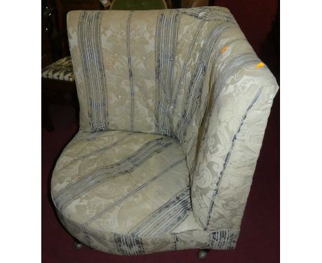 A mid 20th century corner chair, the whole upholstered in a button backed silk and striped damask and raised on turned feet w