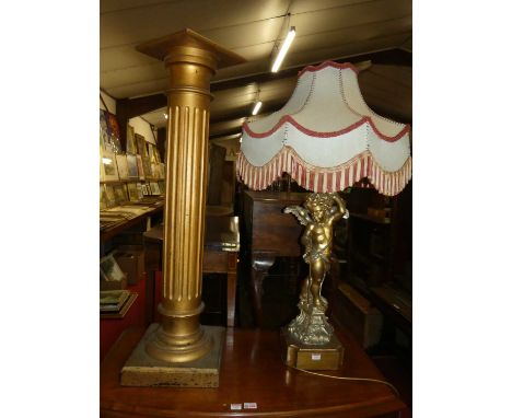 A gilt composition cherub table lamp with shade; together with a painted and gilded torchere, gross h.225cm