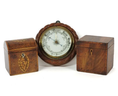 Two Georgian mahogany and burr yew wood tea caddies, 12 and 12.5cm wide, and an aneroid barometer, 18.5cm diameter