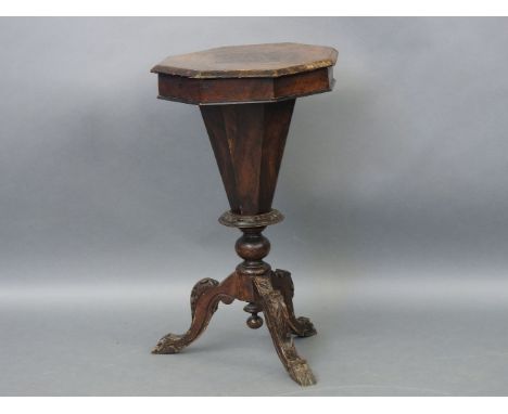 A Victorian walnut trumpet form work table, the hexagonal top on carved tripod base, 45cm wide, 77cm high