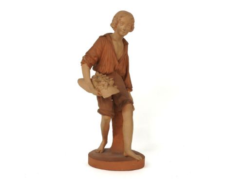 A Watcombe pottery figure, of a woodsman holding an axe and a nest of birds, printed mark, 37cm high