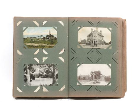 A large Edwardian postcard album, approx 150 cards