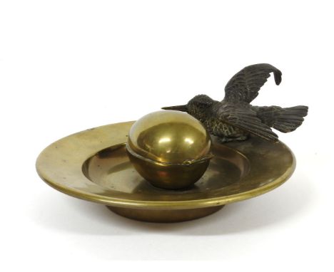An inkwell, modelled as a cold painted kingfisher perched on the side of a dish, the inkwell an egg, 17cm