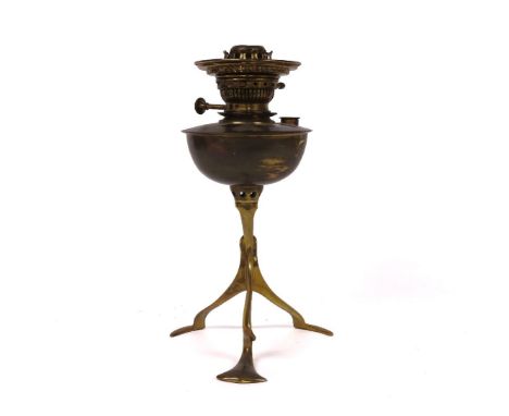 In the manner of W.A.S. Benson, a copper and brass oil lamp, 32cm high