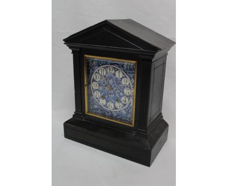 A 19th century mantel clock with blue and white floral ceramic square dial within brass mounted ebonised angular case, 14" hi