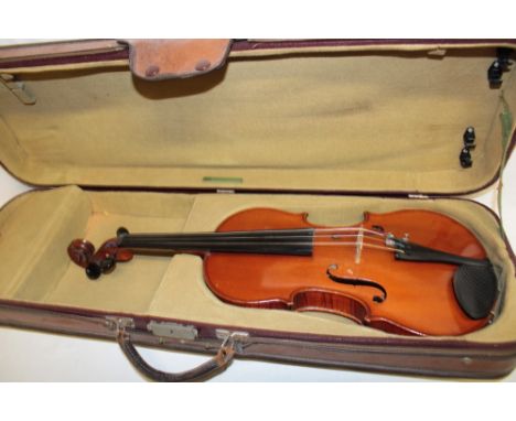 A good quality Continental violin by M. Couturieux with 14" figured two-piece back in fitted case