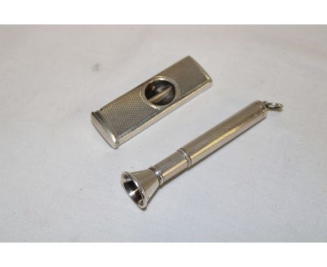 A silver engine turned spring-action cigar piercer, Birmingham marks 1961 together with a similar silver engine turned cigar 