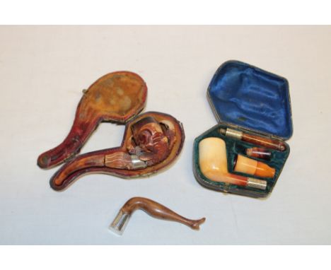 A carved meerschaum smoker's pipe in the form of a bird's claw and egg in leather case; a meerschaum four piece smoker's pipe