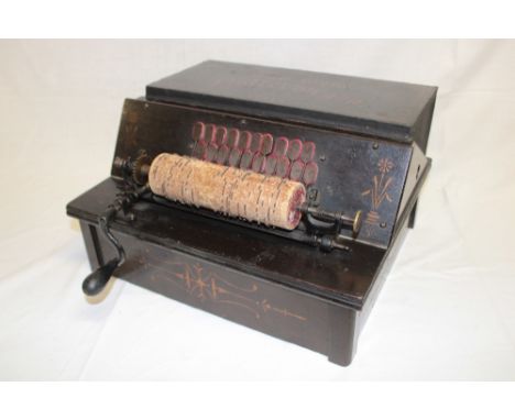 An unusual old portable roller organ "The Gem Roller Organ" in original stained wood decorated case