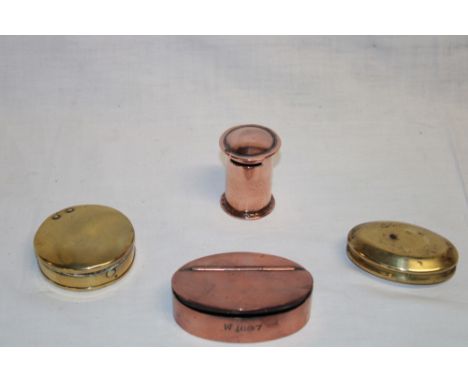 A 19th century copper oval snuff box marked "W1887"; brass Welsh Miner's-style oval snuff box; one other brass circular snuff