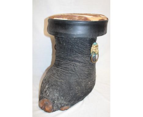 An old elephant's foot stool with lion's mask handles and skin covered seat, 17" high