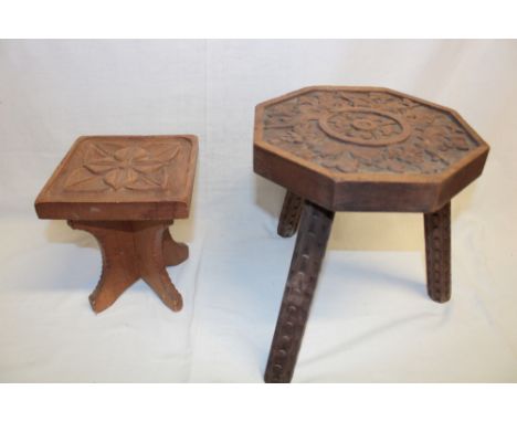 An Arts and Crafts-style carved wood square occasional table with floral decorated top, 8½" high and one other carved wood oc