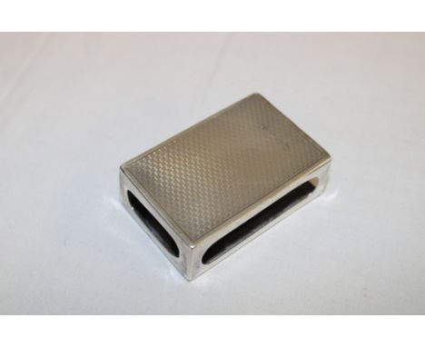 A George V silver rectangular match-holder with engine turned decoration, Birmingham marks 1926