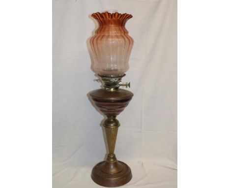 A good quality old brass and copper oil lamp with tapered fluted stem and opaque glass shade