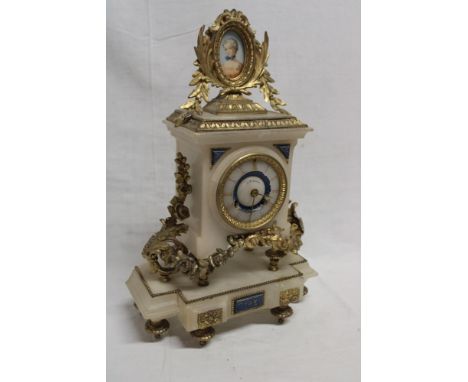A good quality French brass mounted marble chiming mantel clock with decorated circular dial by J W Benson in ornamental case