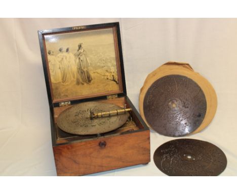 A 19th century Continental polyphon marked "Timbro Variante" with a selection of twelve 9" discs in polished walnut case