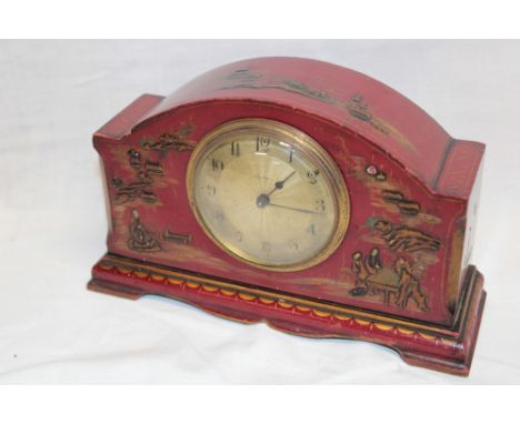 A 1930's/40's mantel clock by Asprey with gilt circular dial in red lacquered chinoiserie arched case