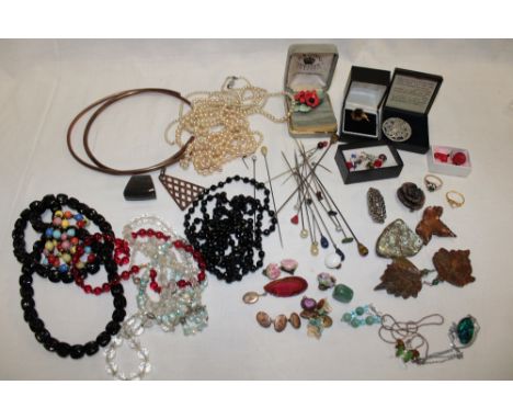 A large selection of various costume jewellery including necklaces, brooches, stick-pins, earrings, dress rings etc.