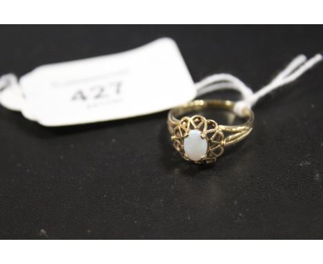 A CONTINENTAL OPAL SET RING STAMPED TO THE OUTER BAND P583