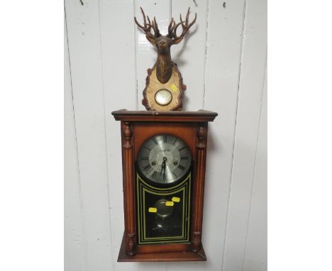 A LEGEND WALL CLOCK TOGETHER WITH A PLASTIC BAROMETER 