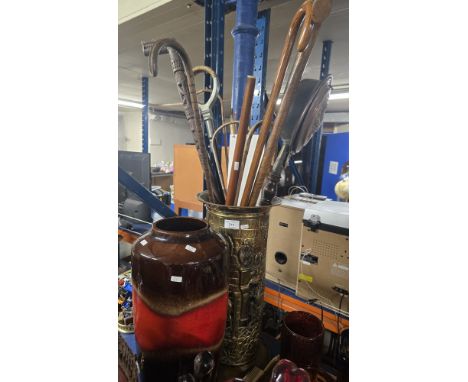 BRASS STICK STAND WITH QUANTITY OF VARIOUS STICKS, SHOOTING STICK, BED WARMER, WEST GERMAN POTTERY STICK STAND
